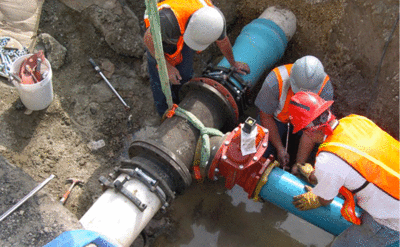 Broad River Water Plant Crew Digging Putting a Pipe Together